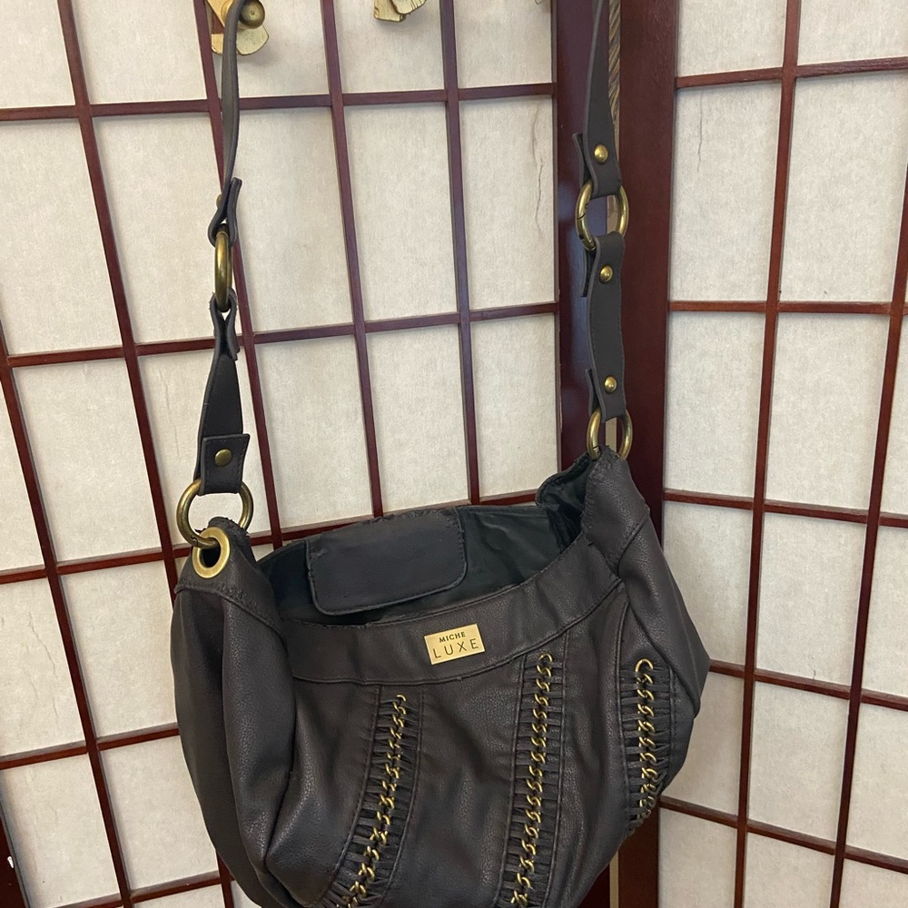 Miche Luxe shoulder bag showing wear